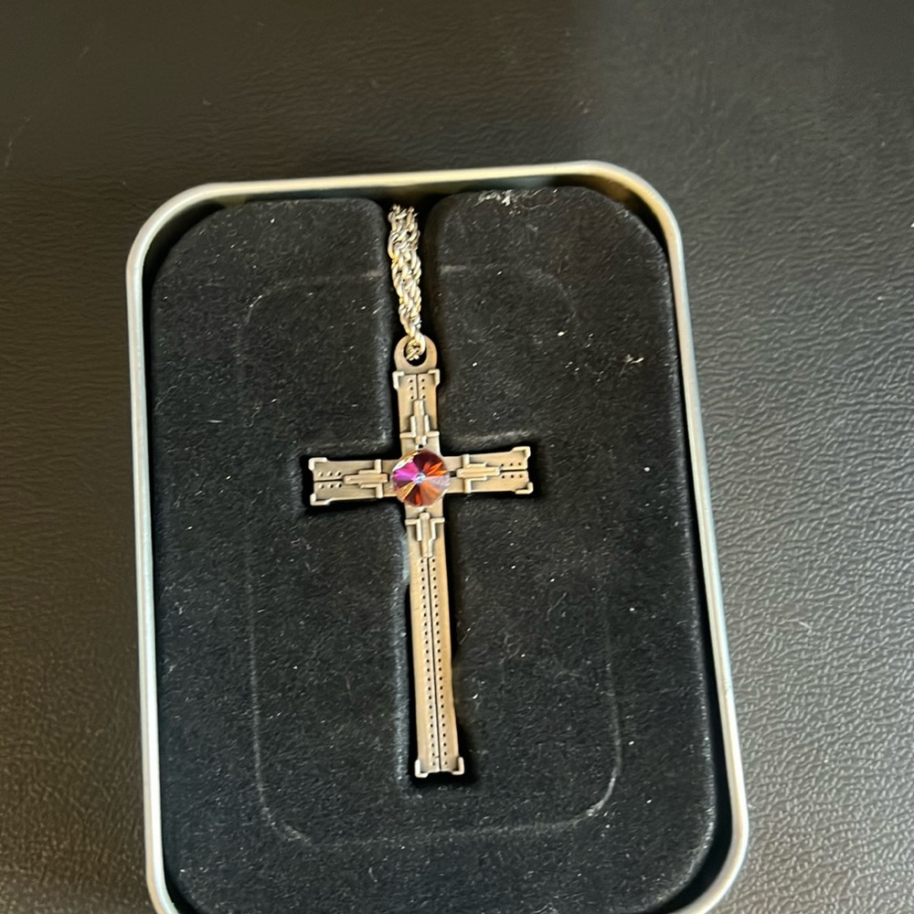 Metal cross with rainbow colored stone